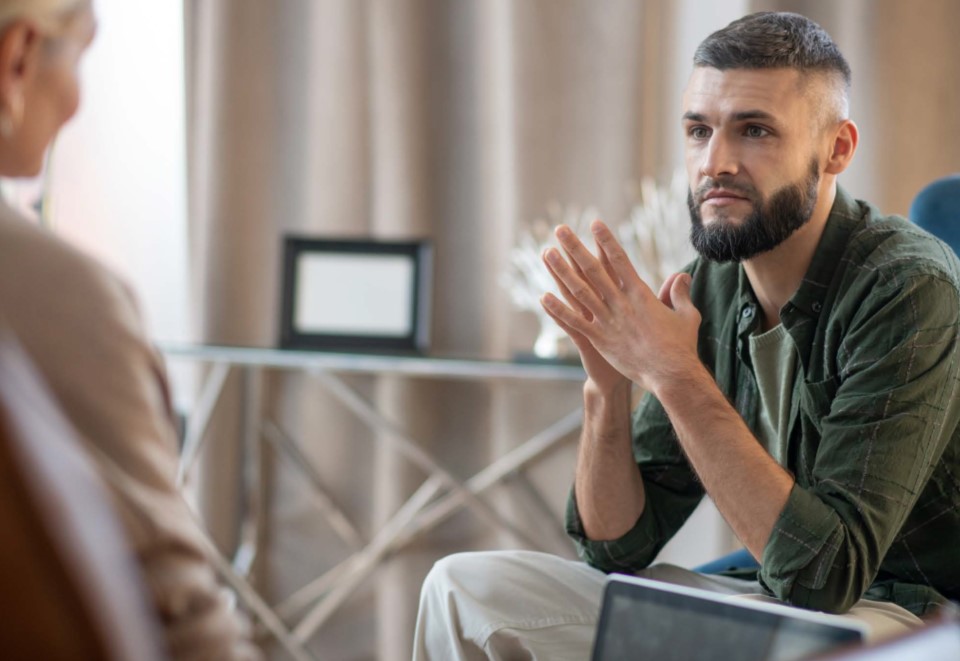 Patient and provider talking in a therapy session