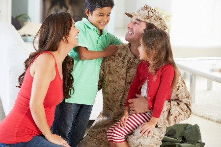 Military Veteran hugging his family