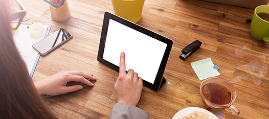 hand on tablet device