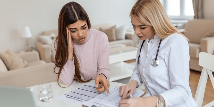 Women reviewing medical bills 