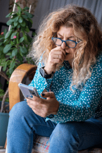 woman looking at her phone