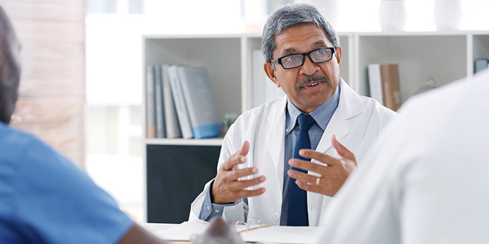 Scientist talking to veterans