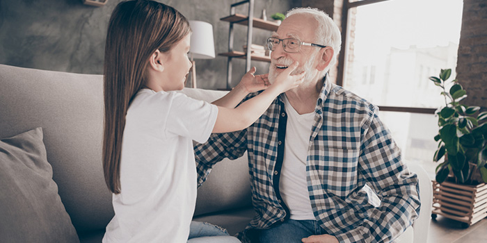 Grandfather happily with his granddaughter