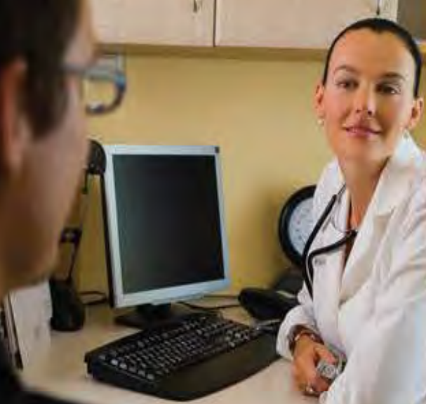 Nurse talking to patient.