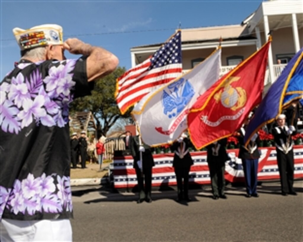 Pearl Harbor Survivor saluting U.S. Navy Color Guard at Pearl Harbor Remembrance Ceremony