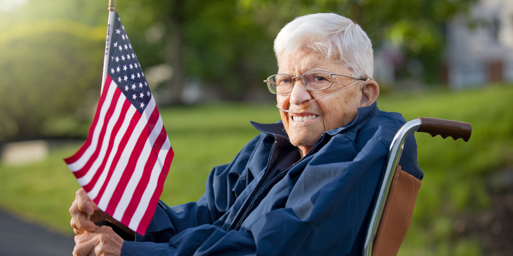 United States Armed Forces Veteran holding American flag